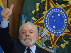 Brazil's President Luiz Inacio Lula da Silva gives a thumbs up sign during a breakfast with journalists at Planalto presidential palace in Brasilia, Brazil, Friday, Oct. 27, 2023, on his 78th birthday.