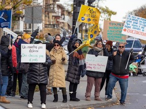 Striking teachers from three Lester B. Pearson School Board schools in the Lachine borough picket at a busy intersection Lachine Nov. 6, 2023.