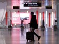Travellers make their way through Pearson International Airport in Toronto