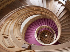 The spiral staircase at the provincial legislature is pictured. The New Brunswick government has released its latest edition of the province's supplementary employee lists, commonly known as the blue book, revealing the salary range of every provincial civil servant earning over $80,000.