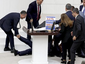 Hasan Bitmez is attended to as he lies on the floor after collapsing during a speech in the Turkish Grand National Assembly in Ankara on Dec. 12.