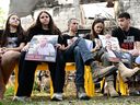 Relatives hold portraits of Israeli hostages held in the Gaza Strip since the Oct. 7 attack by Hamas, during a visit to Kibbutz Beeri in southern Israel near the border with Gaza on on Wednesday.