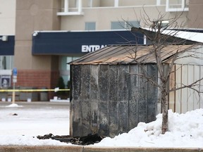 A garden shed that caught fire is shown in the parking lot of a Lowe's store at Crowfoot Crossing in northwest Calgary on Monday, December 11, 2023. Three people died.