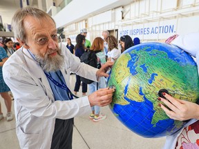 Environmental activists demonstrate at the COP28 climate conference in Dubai on Dec. 6, 2023.