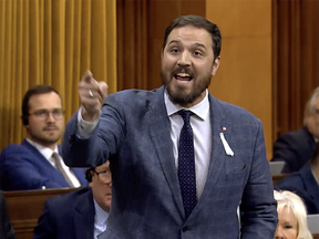 Damien Kurek pointing a finger in the House of Commons