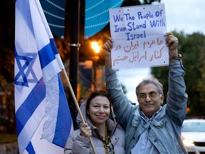 A member of Montreal’s Iranian community shows his support for the Jewish community during an Oct. 9 vigil for the victims of the Oct. 7, 2023 attack by Hamas that killed 1,200 Israelis.