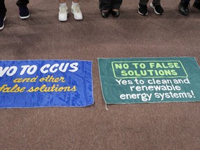 Activists participate in a demonstration calling for climate solutions at the COP28 U.N. Climate Summit, Tuesday, Dec. 5, 2023, in Dubai, United Arab Emirates.
