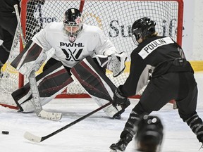 Montreal's Marie-Philip Poulin moves in on goaltender Ann-Renee Desbiens during the Professional Women's Hockey League's (PWHL) training camp in Montreal, Saturday, November 18, 2023.&ampnbsp;The six-team Professional Women's Hockey League has partnered with three Canadian broadcast networks for its inaugural season starting Monday.&ampnbsp;THE CANADIAN PRESS/Graham Hughes