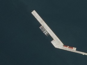 This satellite image provided by Planet Labs PBC shows what appear to be two Chinese warships docked the Ream Naval Base in Cambodia on Dec. 3, 2023. (Planet Labs PBC via AP)