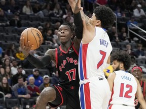 Toronto Raptors guard Dennis Schroder (17) attempts a layup as Detroit Pistons guard Killian Hayes (7) defends during the first half of an NBA basketball game Saturday, Dec. 30, 2023, in Detroit.