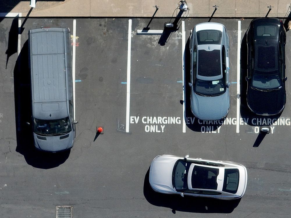 Electric cars parked at an EV charging station in Corte Madera, California.