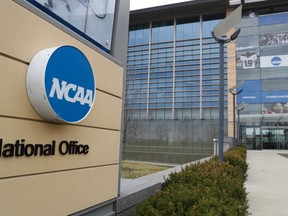 FILE - This is a March 12, 2020, file photo showing NCAA headquarters in Indianapolis. A lawsuit filed in West Virginia's northern district challenges the NCAA's authority to impose a one-year delay in the eligibility of certain athletes who transfer between schools. The suit said the rule "unjustifiably restrains the ability of these college athletes to engage in the market for their labor as NCAA Division I college athletes."