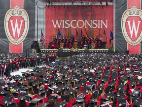 FILE - The commencement address is given during graduation at the University of Wisconsin, May 12, 2018, in Madison, Wis. The head of the Universities of Wisconsin system declined to reveal what the school's regents discussed in a closed meeting Tuesday, Dec. 12, 2023, after the collapse of a contentious deal with Republican lawmakers that would have required campuses to slash diversity positions and scrap an affirmative action program at UW-Madison in exchange for employee raises and funding for construction projects.