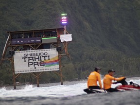 FILE - The judges' tower is seen during the Tahiti Pro surfing competition, seen as a test event for the Paris 2024 Olympics Games, at Teahupo'o beach, Tahiti, a French Polynesia island in the Pacific Ocean, Friday, Aug. 11, 2023. Tony Estanguet, head of the Paris Olympics organizing committee, said Monday Dec.11, 2023 that preparations at Teahupo'o will start again this week, after the president of French Polynesia, Moetai Brotherson, held talks with campaign groups on the island that are concerned about plans to build a tower for surfing judges and television cameras in the Teahupo'o lagoon, fearful it will damage the coral reefs.
