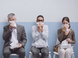 Three sick people waiting to see a doctor.