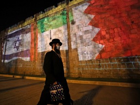The flags of Israel, the United Arab Emirates and Bahrain are projected on the ramparts of Jerusalem's Old City on September 15, 2020 in a show of support for Israeli normalization deals with the United Arab Emirates and Bahrain.