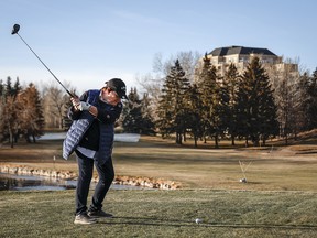 A woman plays golf in Calgary in December.