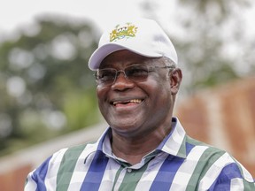 FILE- Former Sierra Leone President Ernest Bai Koroma smiles in Massessehbeh village outside Freetown, SierraLeone, Aug. 14, 2015. Koroma has been invited by the nation's police to be questioned over the recent attacks that officials called a failed coup, a government spokesman said Thursday, Dec. 7, 2023.