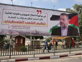 A billboard depicting Saleh al-Arouri, a senior leader of the Palestinian Hamas movement, is pictured in Gaza City on August 28, 2023.