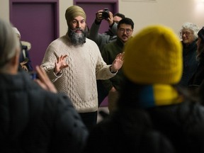 Federal NDP leader Jagmeet Singh speaks with volunteers before door knocking in Edmonton's Inglewood neighbourhood, Monday Jan. 22, 2024.
