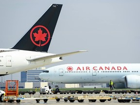 Air Canada planes on the tarmac.