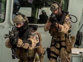 Members of the Canadian Navy's Maritime Tactical Operations Group conduct a boarding exercise on HMCS Charlottetown in a file photo from Aug. 29, 2017.