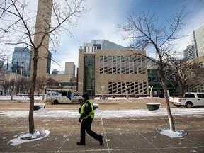 A sheriff patrols Edmonton city hall.