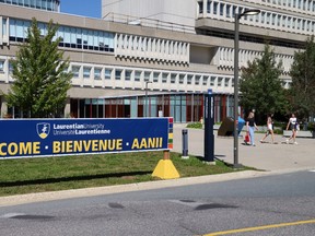 Students walk on Laurentian University's campus.