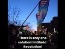 In this screenshot of a video posted to social media, a man is seen holding a flag belonging to the Ontario Public Service Employees Union (OPSEU) during an anti-Israel rally in Toronto on Jan. 14. Jewish OPSEU members say their union's apparent support for the rally is putting them at risk.