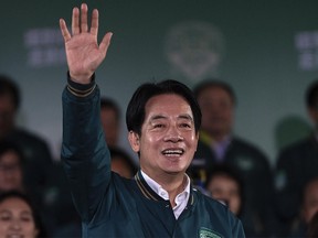 Taiwanese Vice-President Lai Ching-te, also known as William Lai, celebrates his victory in Taiwan's presidential election on Jan. 13, 2024.