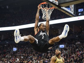 Los Angeles Clippers forward Kawhi Leonard (2) dunks during first half NBA basketball action against the Toronto Raptors, in Toronto on Friday, January 26, 2024.