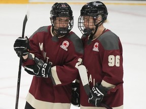 Czech hockey players Tereza Vanisova and Dominika Laskova, best friends since age 12, were drafted together by Montreal in the Professional Women's Hockey League. Vanisova (21) and Laskova (96) following their PWHL hockey game against Boston, in Montreal on Saturday, Jan. 13, 2024.