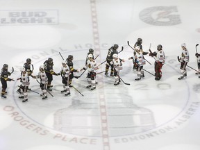 <Hockey players in Newfoundland and Labrador will once again be lining up to shake hands after each game. Vegas Golden Knights and Chicago Blackhawks shake hands after NHL Western Conference Stanley Cup playoff action in Edmonton, Tuesday, Aug. 18, 2020.