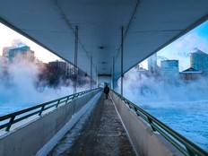 The Bow River and downtown buildings in Calgary during extreme cold.