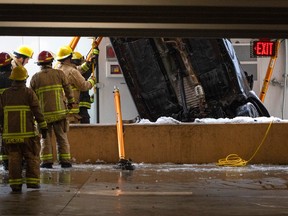 The scene where a car drove off of a parkade and fell to the ground.