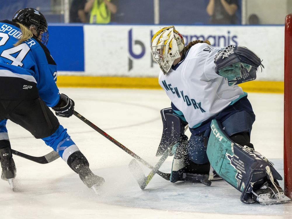 Toronto's Natalie Spooner (24) scores on New York goaltender Corinne Schroeder during second period PWHL action in Toronto on Friday January 26, 2024.