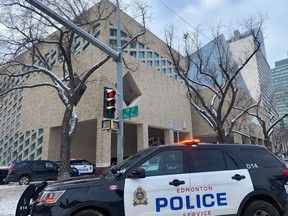 An Edmonton police cruiser is parked outside Edmonton city hall after reports of shots fired on Tuesday, Jan. 23, 2024. City police say one person has been arrested. Roadways around city hall have been closed and citizens are asked to avoid the area. Shaughn Butts/Postmedia