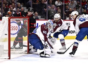 Ottawa Senators defenceman Jake Sanderson (85) watches his shot go in the back of the net behind Colorado Avalanche goaltender Justus Annunen (60) during second period NHL hockey action in Ottawa, on Tuesday, Jan. 16, 2024.