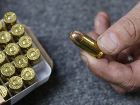 FILE - Chris Puehse, owner of Foothill Ammo, displays .45-caliber ammunition for sale at his store in Shingle Springs, Calif., on June 11, 2019. A federal judge on Tuesday, Jan. 30, 2024, struck down a California law requiring people pay for a background check every time they purchase ammunition.