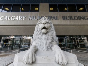 A lion statue outside Calgary City Hall .