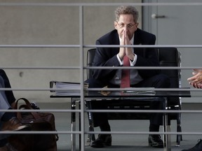 FILE - Hans-Georg Maassen, then head of the German Federal Office for the Protection of the Constitution waits for the beginning of a hearing at the home affairs committee of the German federal parliament, Bundestag, in Berlin, Germany, Wednesday Sept. 12, 2018. Germany's domestic intelligence agency has put its former head, who has become a hard-right politician since being removed from the job several years ago, under scrutiny. Hans-Georg Maassen posted a letter from the BfV agency to his lawyer on his website Wednesday, Jan. 31, 2024, following a report that the authority he led from 2012 to 2018 now has him in its files on right-wing extremism.