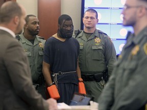 Deobra Redden is escorted into a courtroom