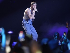 FILE - Bad Bunny performs at the Latin Billboard Awards, Thursday, Oct. 5, 2023, in Coral Gables, Fla. Universal Music Group, which represents artists including Taylor Swift, Drake, Adele, Bad Bunny and Billie Eilish, says that it will no longer allow its music on TikTok now that a licensing deal between the two parties has expired.