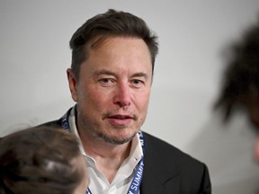 File - Tesla CEO Elon Musk attends the first plenary session of the AI Safety Summit at Bletchley Park, on Nov. 1, 2023 in Bletchley, England. A Delaware judge this week invalidated Elon Musk's $55.8 billion Tesla pay package, saying it is too big and that Musk set the terms with a complaint board.