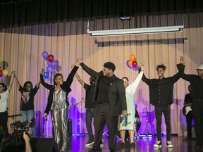 This Nov. 11, 2023 image provided by the Soulsville Foundation shows, from left, Stax Music Academy students Lauren Sanders, Pasley Thompson, Teiona Echols (holding hands with) Rickey Fondren, Joi Stubbs, Zander Henley, Johnathan Cole Jr. from the cast of "Stax Meets Motown." The online show to commemorate Black History Month features music from Memphis-based Stax Records and Detroit's Motown.