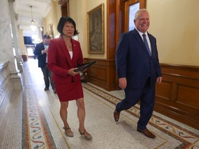 Olivia Chow and Doug Ford walking together