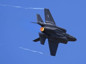FILE - U.S. Air Force fighter aircraft F-35 performs aerobatic maneuvers on the second day of the Aero India 2023 at Yelahanka air base in Bengaluru, India, Tuesday, Feb. 14, 2023. On Monday Jan. 29, 2024, The Czech Republic's government inked a deal with the United States to acquire two dozen U.S. F-35 fighter jets in a deal worth around 150 billion Czech koruna ($6.5 billion).