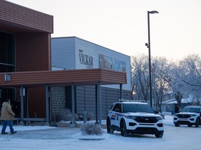 People enter the public coroner's inquest into the mass stabbings that happened on James Smith Cree Nation in 2022 in Melfort, Sask., Friday, Jan. 26, 2024. The last week of the inquest is expected to hear from elders and the Parole Board of Canada.