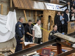Police arrest a man inside a Brooklyn synagogue.
