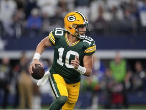 Green Bay Packers quarterback Jordan Love looks to pass against the Dallas Cowboys during the first half of an NFL football game, Sunday, Jan. 14, 2024, in Arlington, Texas.